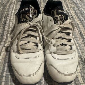Reebok white and leopard print tennis shoes.